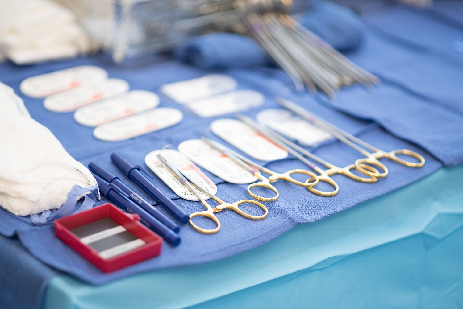 plastic surgery instruments and tools laid out on a surgical table