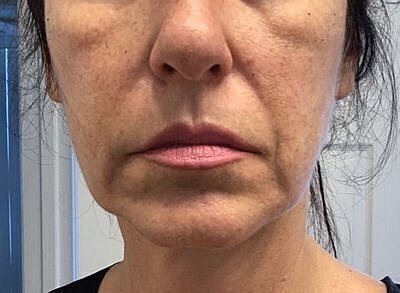 Close-up of a woman's face and expression.