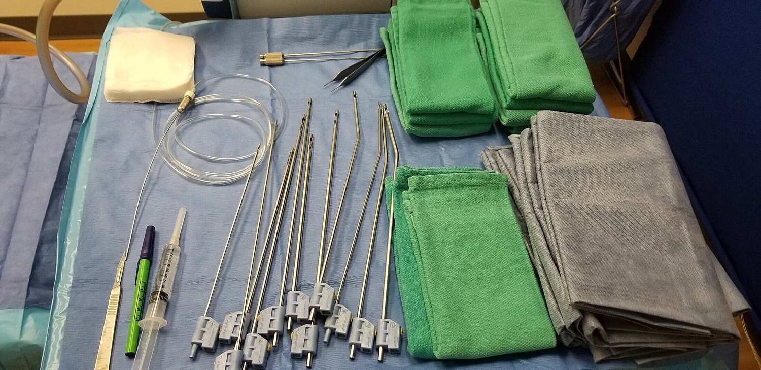 Medical tools and cloths arranged on a table.