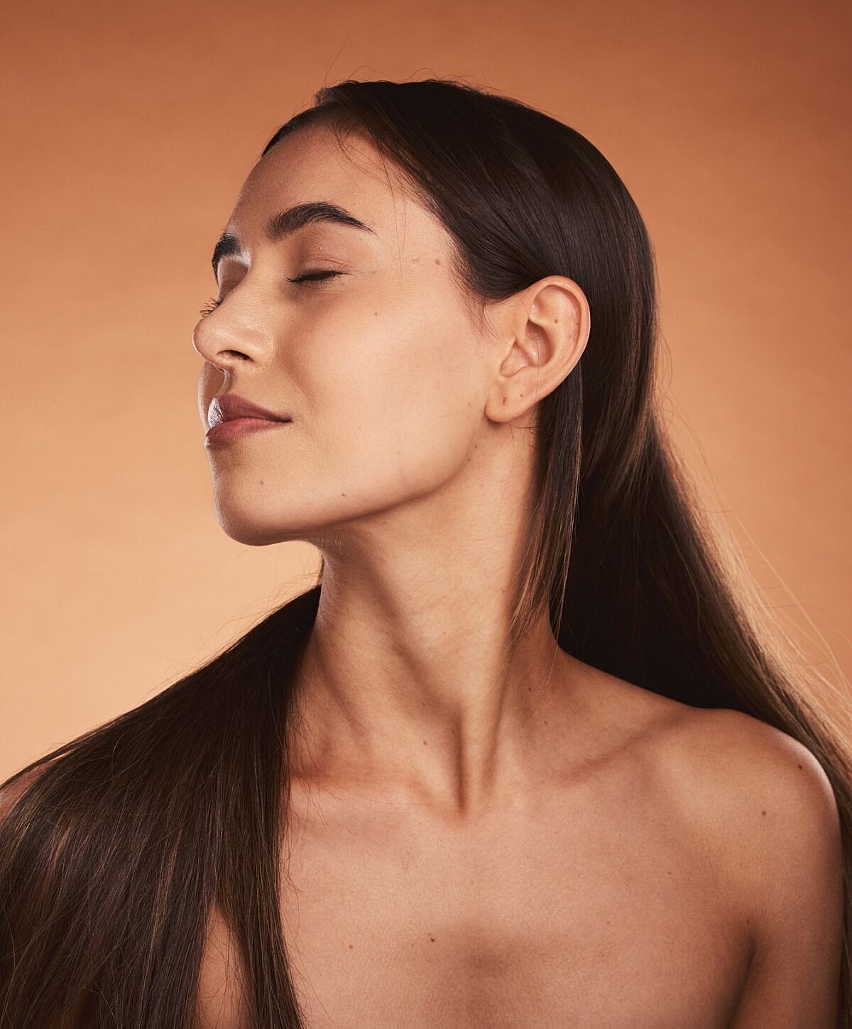 Profile of a woman with closed eyes.