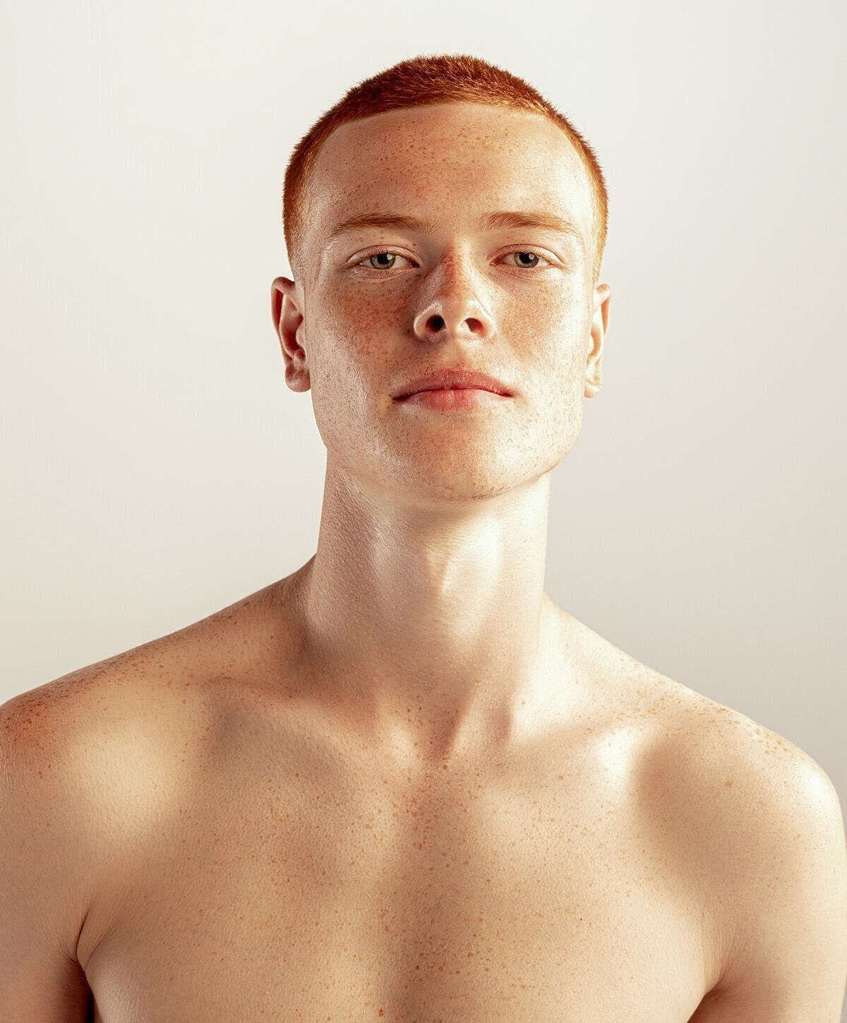 Portrait of a young man with freckles.