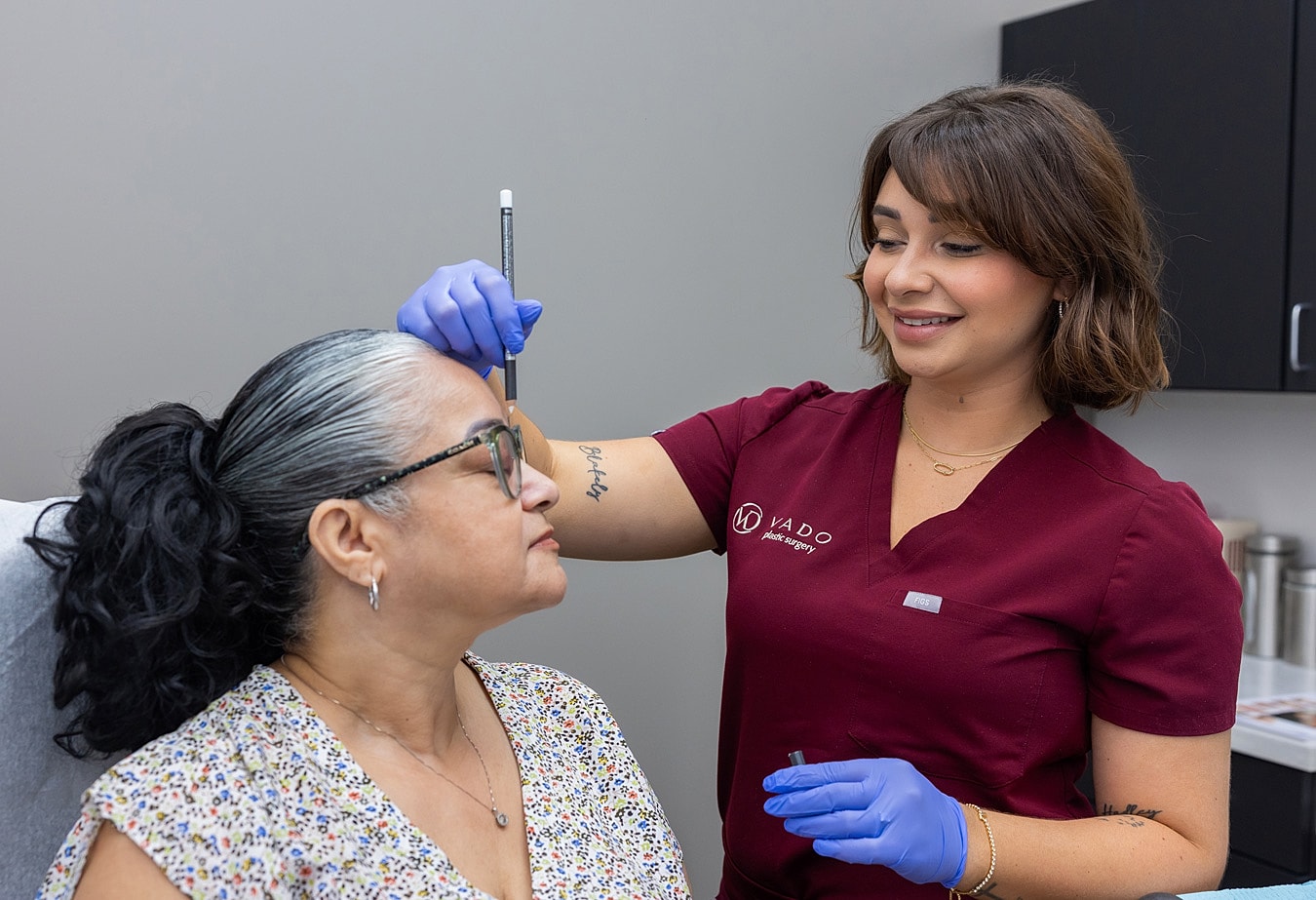 Cosmetic procedure consultation in a medical office.