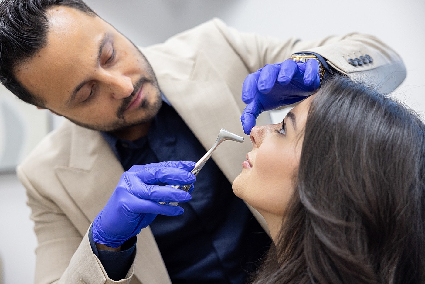 Cosmetic procedure consultation with patient in clinic.