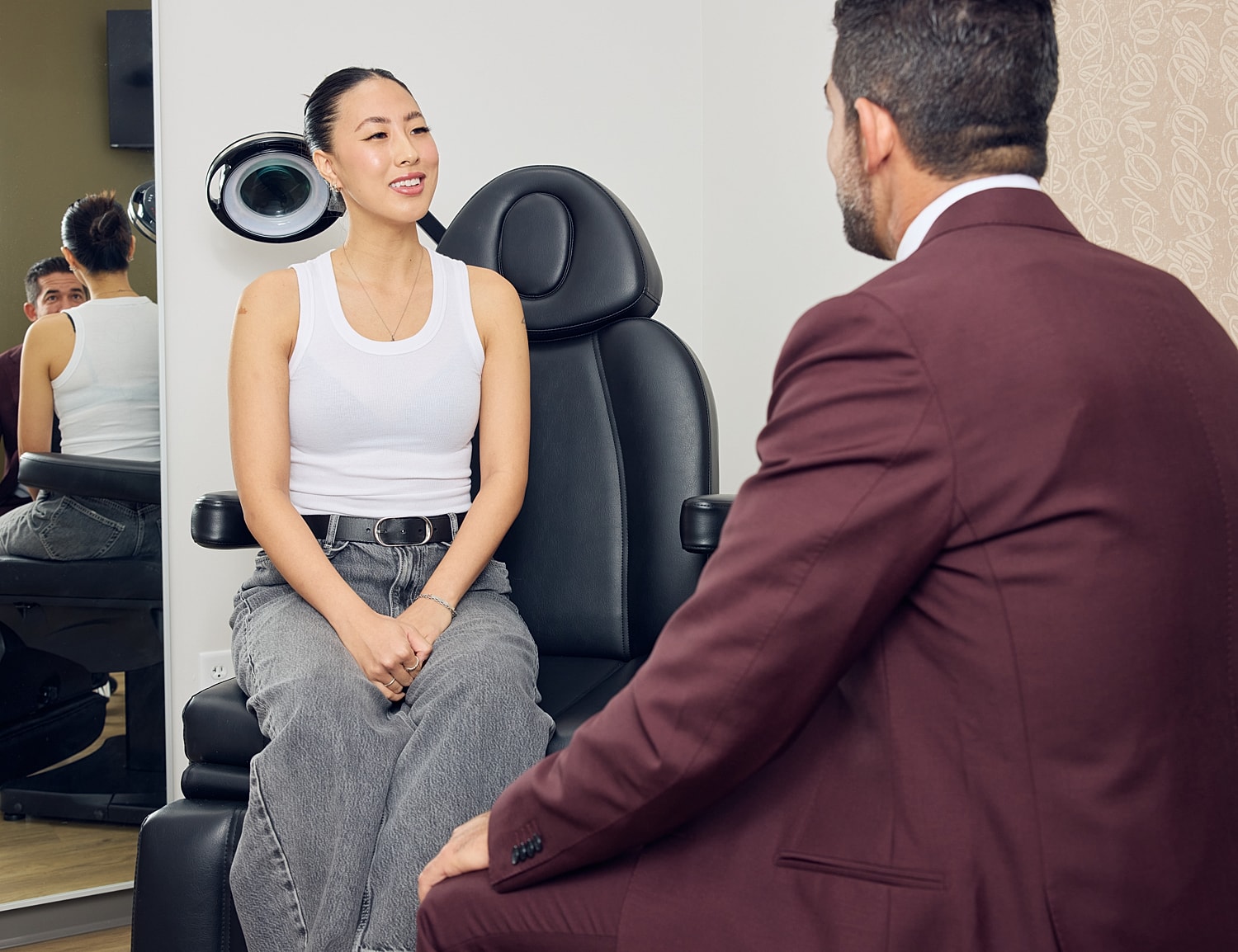 Patient consulting with a professional in a clinic.
