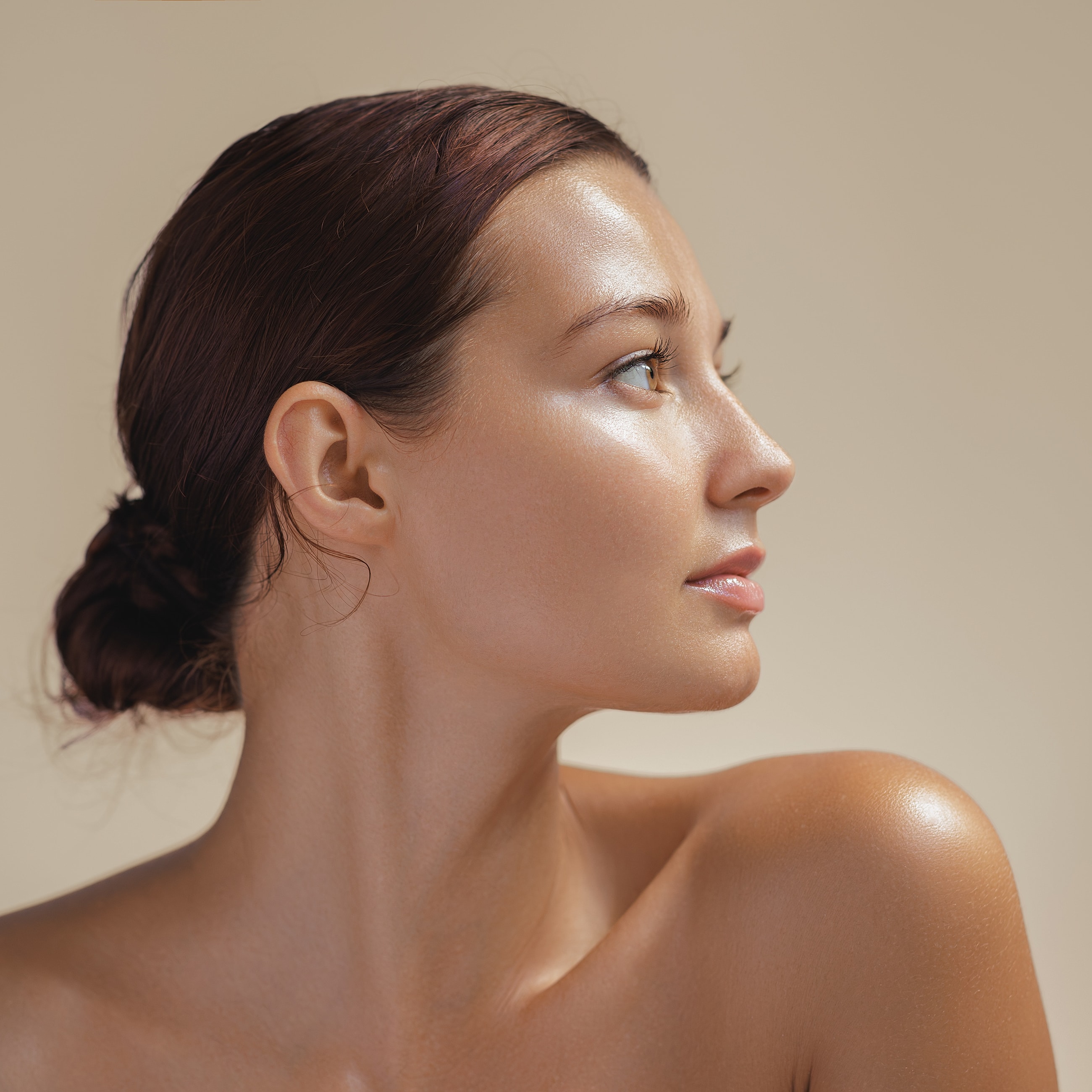 Profile of a woman with glowing skin.